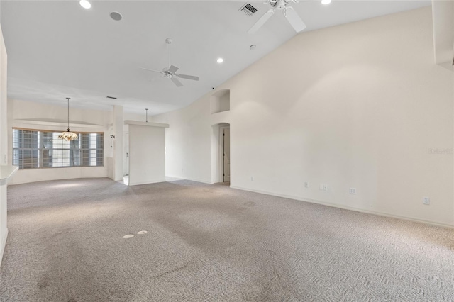 carpeted empty room featuring high vaulted ceiling and ceiling fan