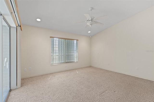 unfurnished bedroom with light colored carpet and ceiling fan