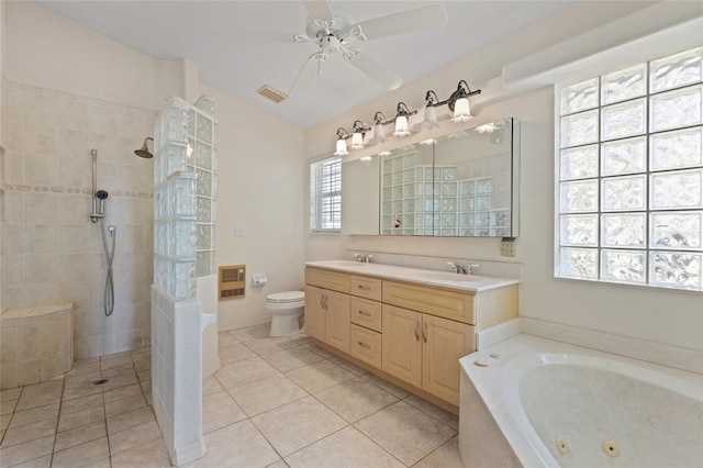 full bathroom featuring tile patterned floors, heating unit, separate shower and tub, vanity, and ceiling fan