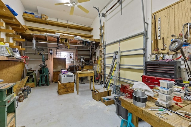 garage with a workshop area and ceiling fan