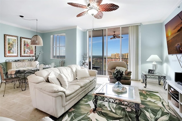 tiled living room featuring a healthy amount of sunlight, ornamental molding, and floor to ceiling windows