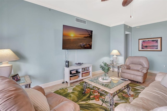 living room featuring crown molding, light tile patterned floors, and ceiling fan