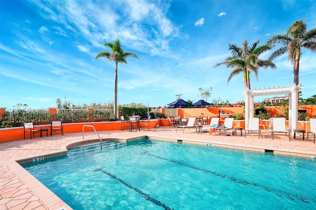 view of pool featuring a patio and a pergola