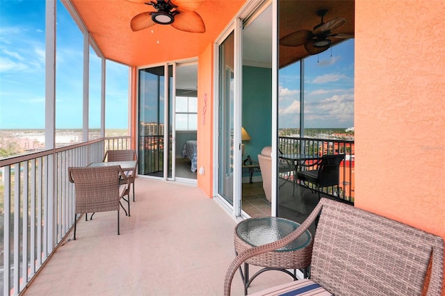 exterior space featuring a water view, ceiling fan, and plenty of natural light