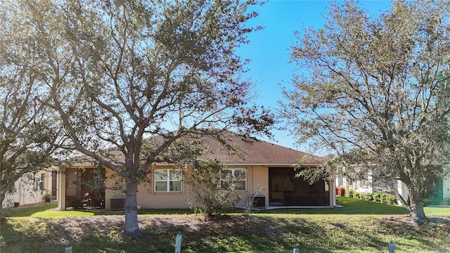 8858 Tuscany Isles Dr, Punta Gorda, FL 33950 - back of property featuring a yard and a sunroom
