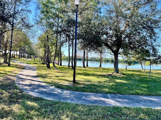 8858 Tuscany Isles Dr, Punta Gorda, FL 33950 - view of property's community with a lawn and a water view