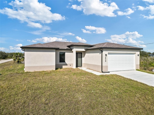 view of front of house featuring a garage and a front yard