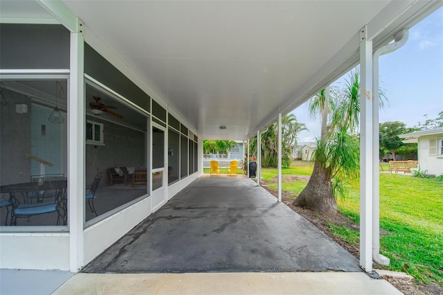 view of patio featuring a sunroom