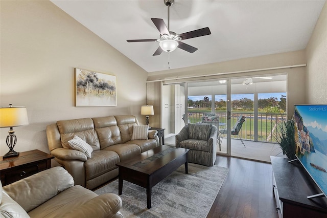 living room with dark wood-type flooring, vaulted ceiling, and ceiling fan