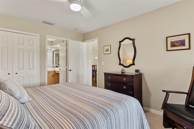 bedroom with a closet, ceiling fan, and carpet flooring