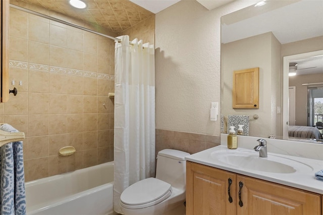 full bathroom with toilet, vanity, and shower / bathtub combination with curtain