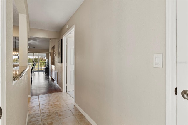 hallway with light tile patterned flooring