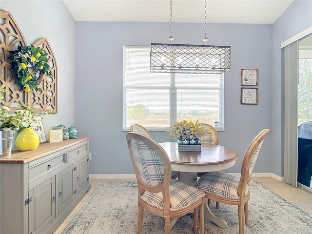 dining space featuring light tile patterned floors