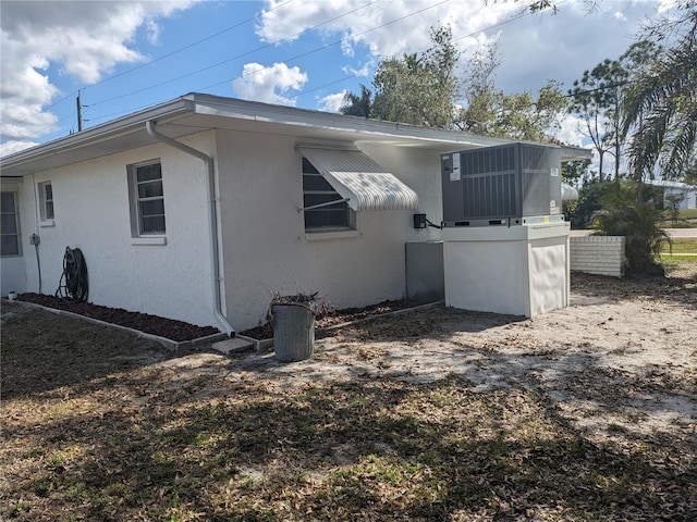 710 Aqui Esta Dr, Punta Gorda, FL 33950 - view of side of home featuring cooling unit