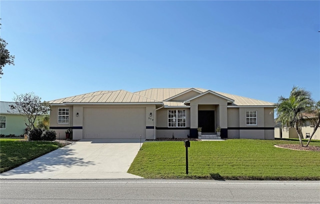 view of front facade featuring a garage and a front lawn