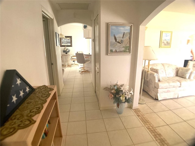 corridor with light tile patterned floors