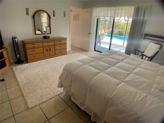 bedroom featuring light tile patterned flooring and access to exterior