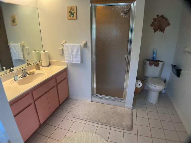 bathroom with vanity, tile patterned floors, toilet, and walk in shower