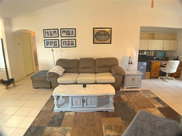 tiled living room with lofted ceiling