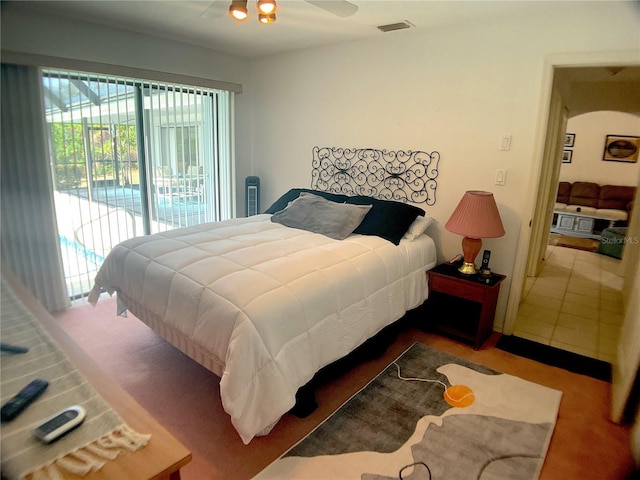 bedroom featuring access to exterior and ceiling fan