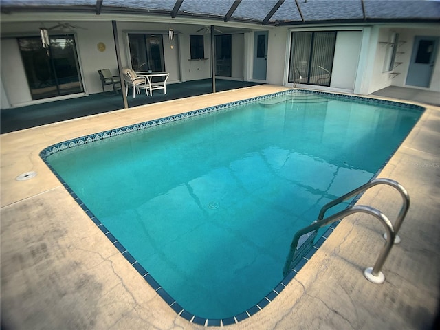 view of pool featuring a lanai and a patio area