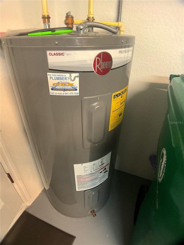 utility room with electric water heater