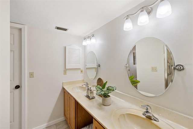 bathroom featuring vanity and tile patterned flooring