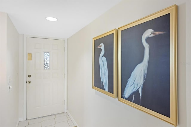 entryway with light tile patterned floors