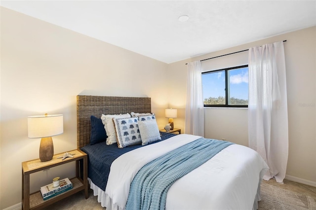 bedroom featuring light carpet