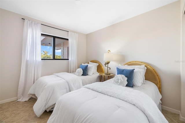 bedroom with light tile patterned floors