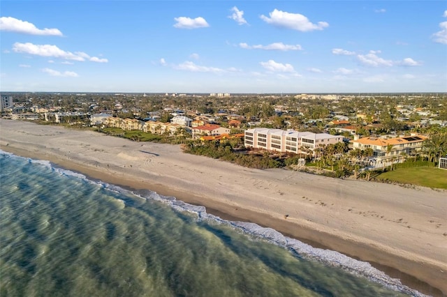 bird's eye view with a water view and a view of the beach