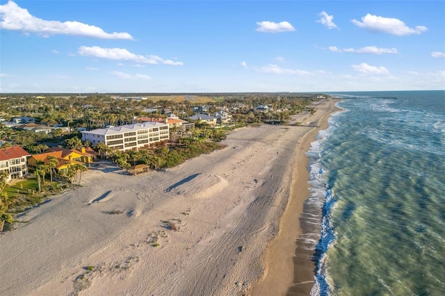 aerial view with a water view and a view of the beach