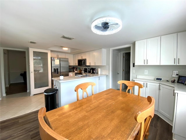 dining area with sink and light tile patterned floors