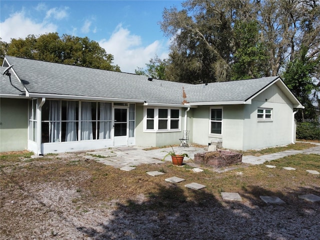 back of house with a patio and a sunroom