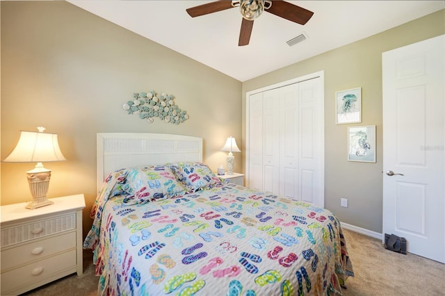 bedroom with light colored carpet, a closet, and ceiling fan