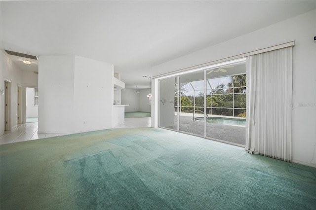 unfurnished living room featuring light carpet