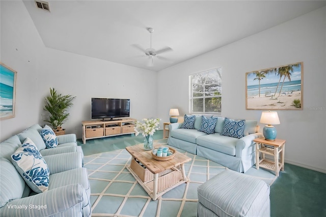 carpeted living room with ceiling fan