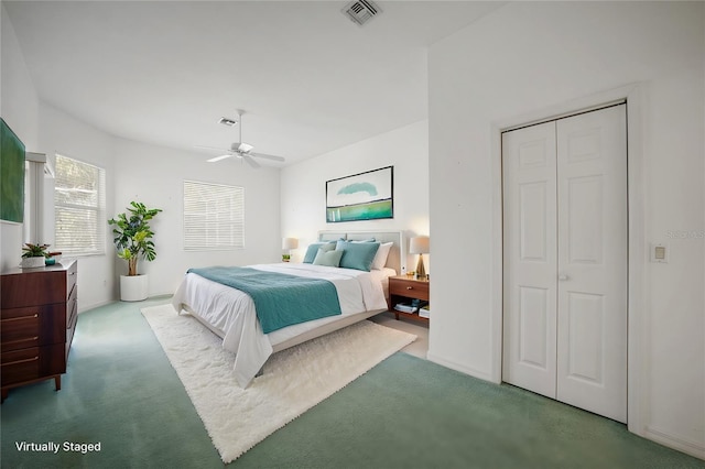 carpeted bedroom featuring ceiling fan