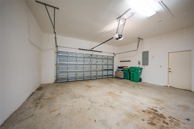 garage featuring a garage door opener and electric panel