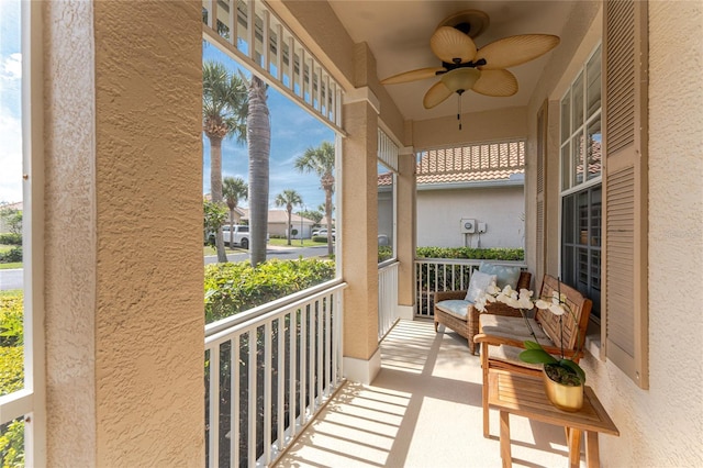 balcony featuring a porch and a ceiling fan