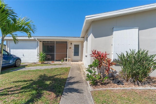 view of front of home featuring a garage and a front lawn