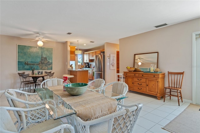 dining room featuring ceiling fan and light tile patterned flooring