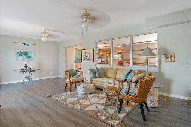 living room featuring hardwood / wood-style flooring and ceiling fan