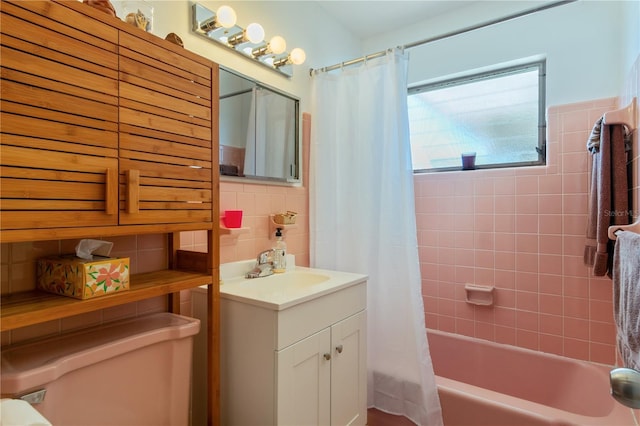 full bathroom with shower / tub combo with curtain, tile walls, vanity, decorative backsplash, and toilet