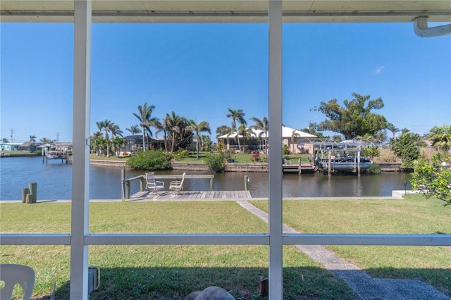 exterior space with a water view and a yard