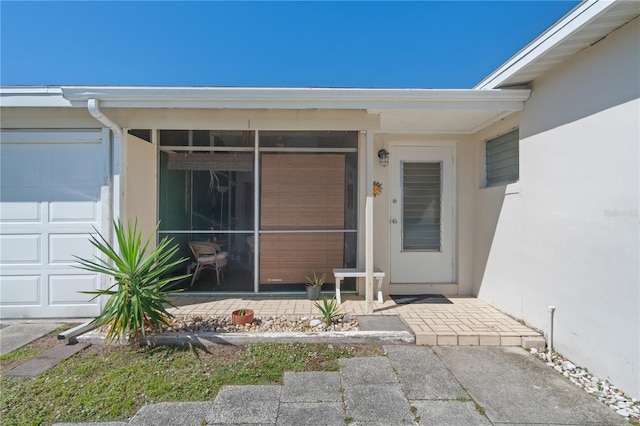 entrance to property featuring a garage