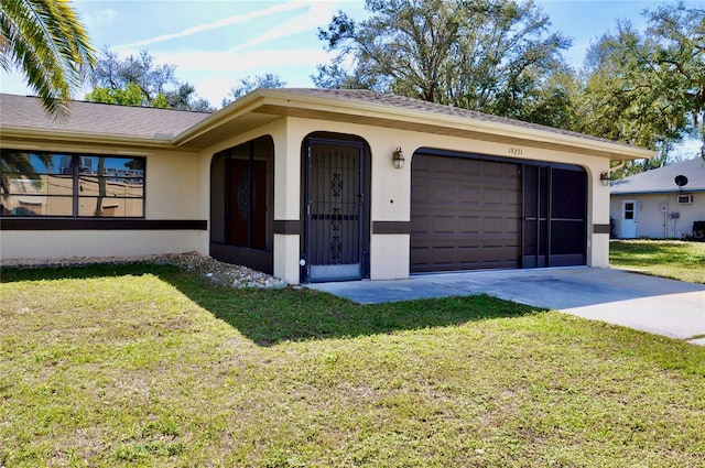 ranch-style house featuring a garage, a front yard, concrete driveway, and stucco siding