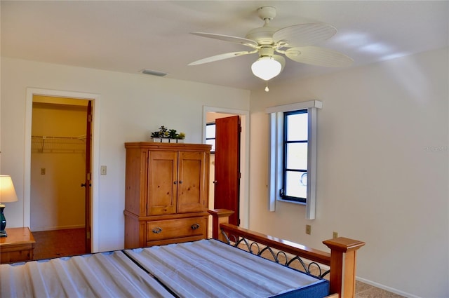 bedroom with ceiling fan and visible vents