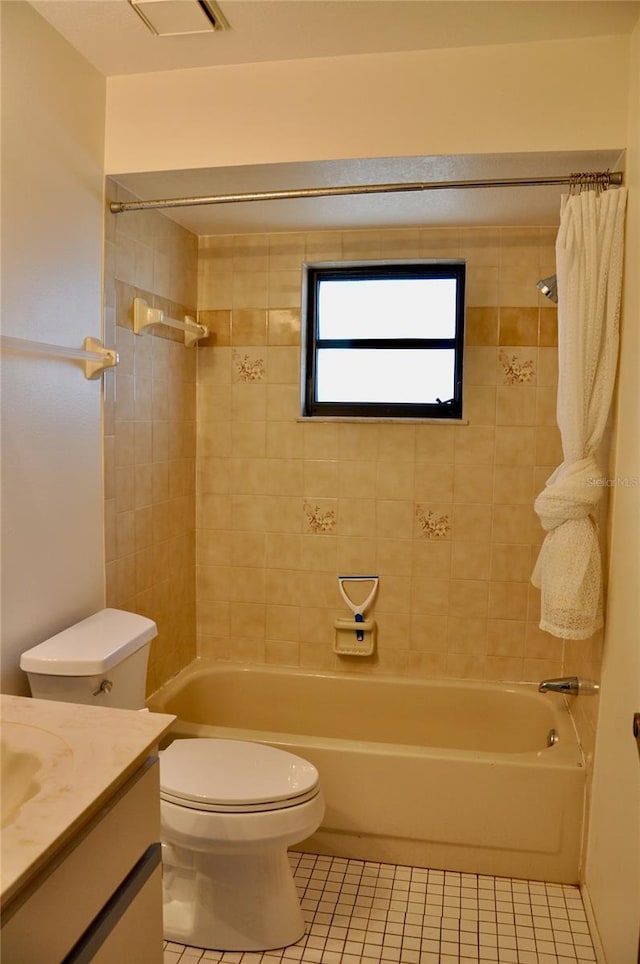 bathroom with toilet, visible vents, vanity, tile patterned floors, and shower / bath combination with curtain