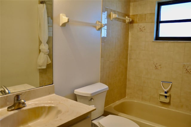 full bath featuring toilet, bathtub / shower combination, and vanity